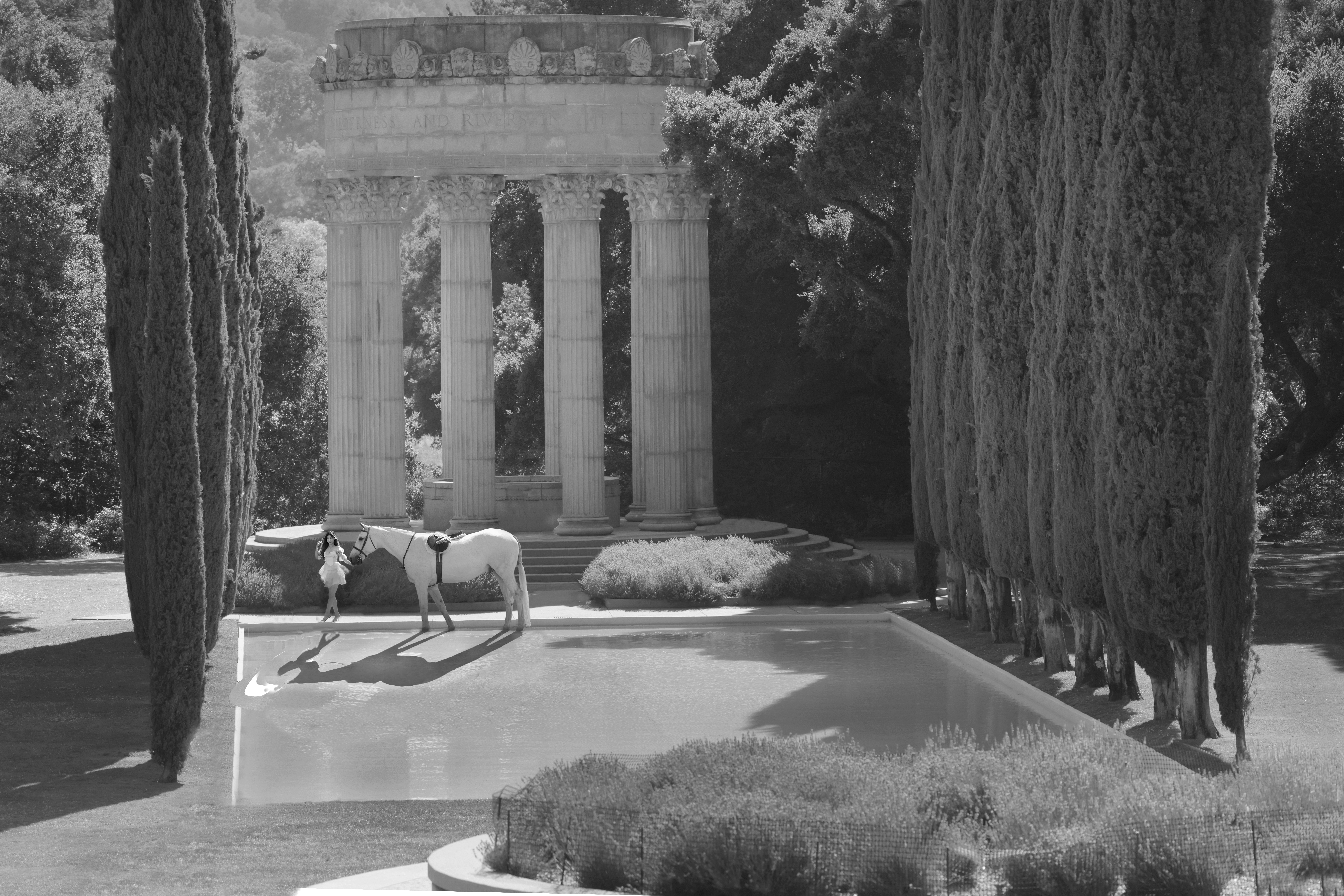 Woman and white horse at Pulgas Water Temple